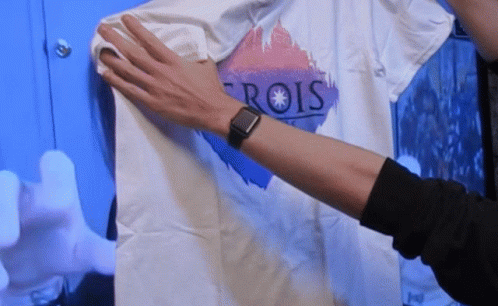 Person Wearing Watch Holding T-Shirt Saying Rois