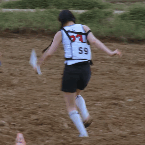 Person Wearing White Tank Top Number 59