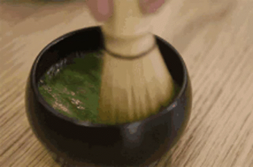 Person Whisking Green Tea GIF
