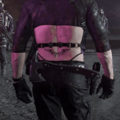 Person With Back Tattoo Saying X