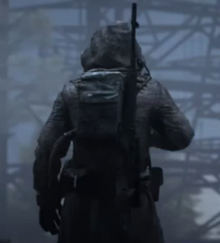 Person with Backpack and Rifle in Fog