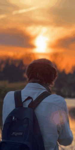 Person With Black Backpack Watching Sunset GIF