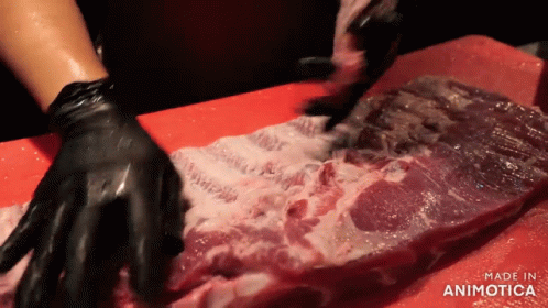 Person With Black Gloves Cutting Meat Red Board Made in Animatica