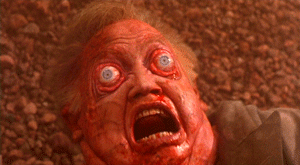 Person With Blood on Face Lying on Ground