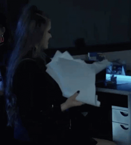 Person With Blue Hair Holding Paper
