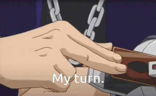 Person With Chains Holding My Turn Card GIF
