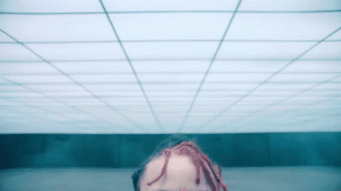 Person With Dreadlocks Looking Up at Ceiling