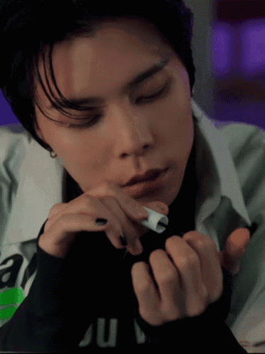 Person With Eyes Closed And Ju On Shirt GIF