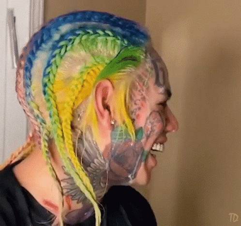 Person With Face Tattoos and TD Text
