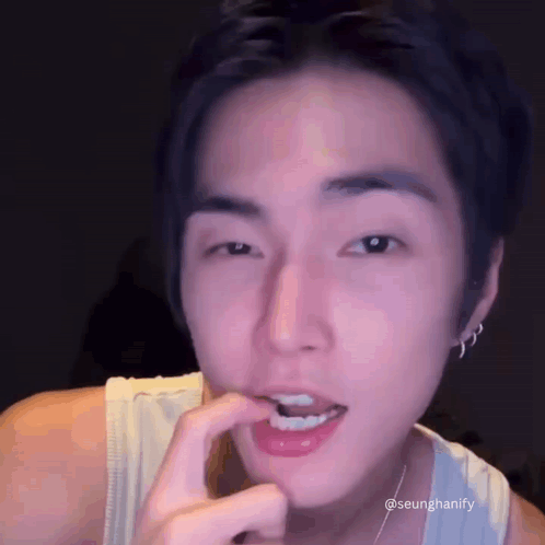 Person with Finger in Mouth