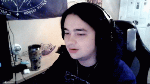 Person With Headphones and Pacia Alphas Sign