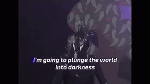 Person With Mask Singing I'm Going to Plunge the World Into Darkness