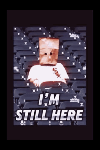 Person With Paper Bag Saying I'm Still Here GIF