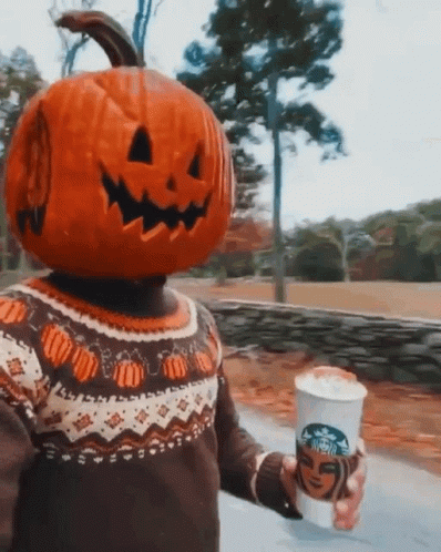 Person With Pumpkin on Head Holding Starbucks Coffee