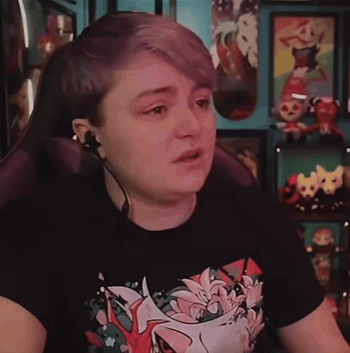 Person With Purple Hair In Floral Black Shirt GIF