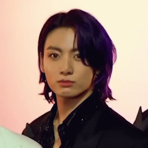 Person With Purple Hair Looking At Camera GIF