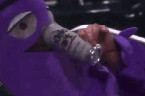Person With Purple Mask Holding Soda