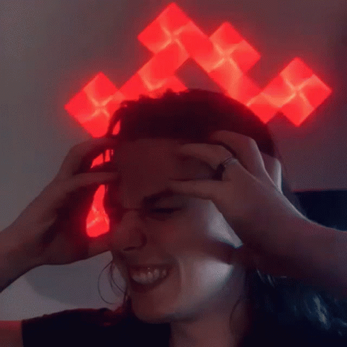 Person With Red Cross On Head Smiling GIF