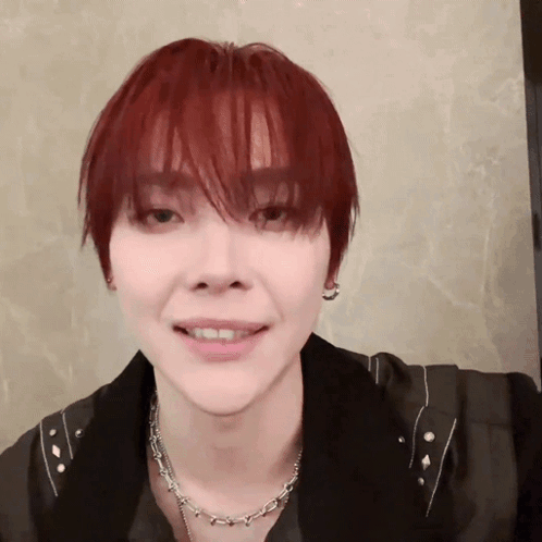 Person with Red Hair and Necklace