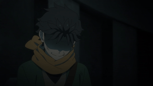 Person With Scarf Standing in Dark Room