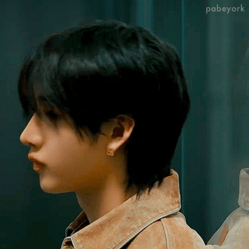 Person With Short Hair in Denim Jacket