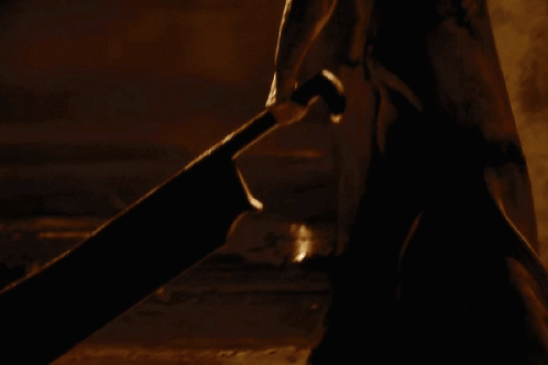Person With Triangle on Back in Dark