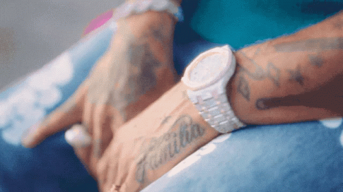 Person With Watch Saying Familia