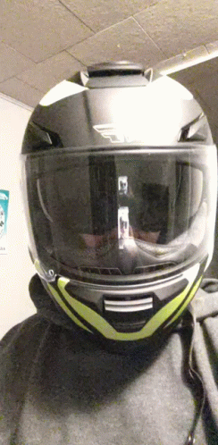 Person With Yellow-Striped Motorcycle Helmet