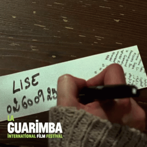 Person Writing Lise On Paper GIF