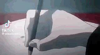 Person Writing on Paper with Pencil