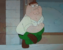 Peter Griffin From Family Guy Is Sitting Down With His Hands Folded GIF