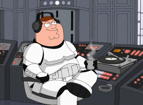 Peter Griffin Is Wearing Headphones And Holding A Cup Of Coffee While Sitting In Front Of A Record Player GIF