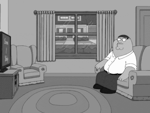 Peter Griffin Sitting On Couch Watching TV GIF