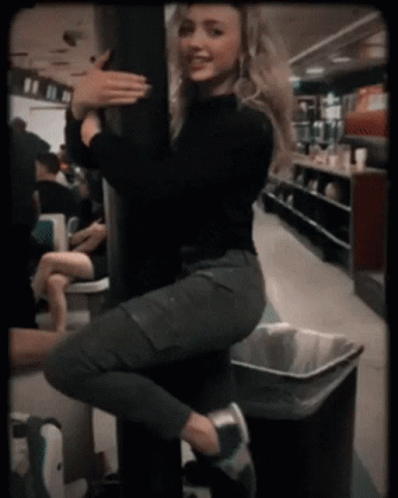 Peyton List Funny Cafe Pole Sliding Down GIF