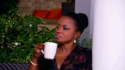 Phaedra Holding A White Mug GIF