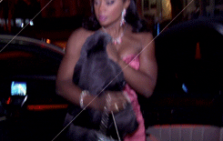 Phaedra Placing Coat On Her Arm GIF