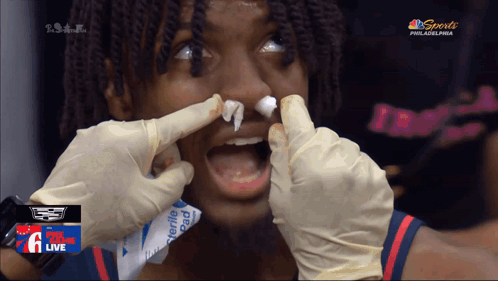 Philadelphia Basketball Player Getting Nose Cleaned