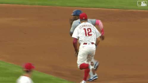 Phillies Baseball Player Laying on Ground With Another Player