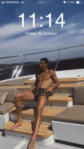 Phone Screen Shirtless Man on Boat 11:14