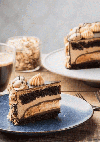 Piece of Cake and Coffee on Blue Plate