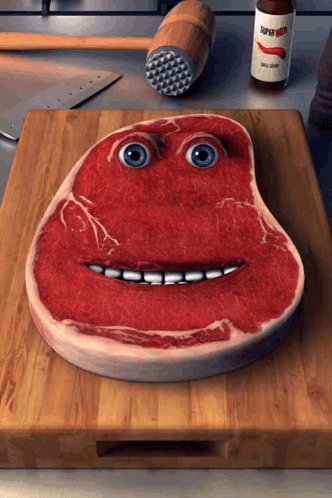 Piece of Meat With Face on Cutting Board