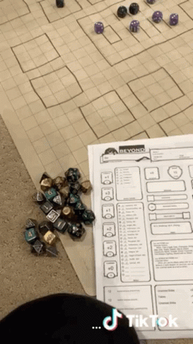 Pile of Dice Beside Paper Saying Beyond