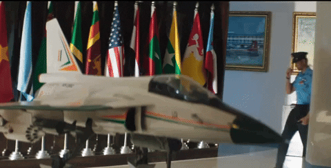 Pilot Passes Through Fighter Jet Figurine GIF