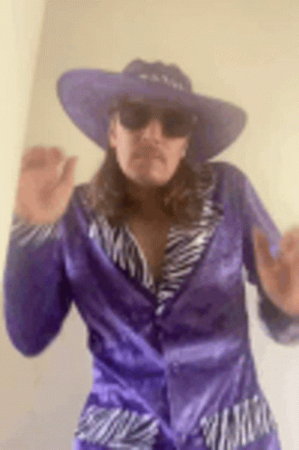 Guy Wearing Carnival 1980's Pimp Costume GIF