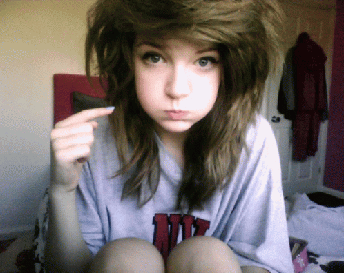 Cute Girl Mimicking Pimple Popping Action GIF