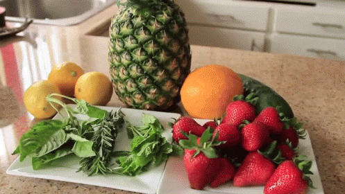 Pineapple Next to Strawberries Lemons and Other Fruits