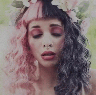 Pink-and-Black-Haired Woman With Flower Crown and Nose Ring