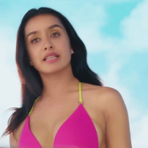 Pink Bikini Woman Looking at Camera Blue Sky