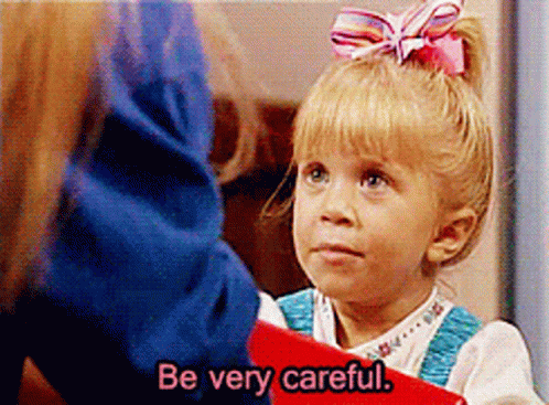 Pink-Bow Girl Holds Red Book Says Be Careful