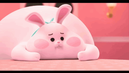Pink Bunny with Bow Laying on Table